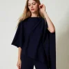 Asymmetrischer Strickponcho